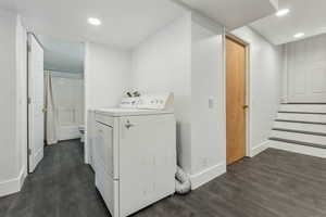 Laundry room with hookup for a washing machine and dark hardwood / wood-style flooring