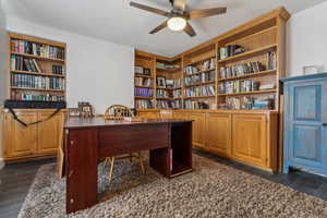 Office with ceiling fan and dark hardwood / wood-style flooring