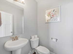 Bathroom featuring sink and toilet