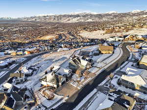 Snowy aerial view with a mountain view