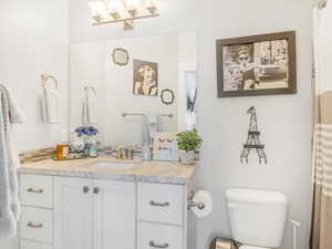 Bathroom featuring vanity and toilet