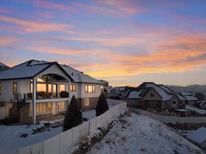 View of snow covered rear of property