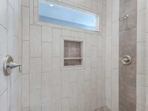 Bathroom with a tile shower