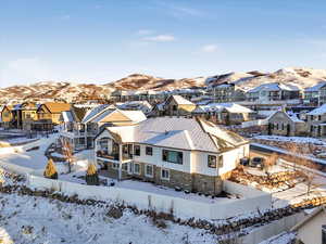 Snowy aerial view featuring a mountain view