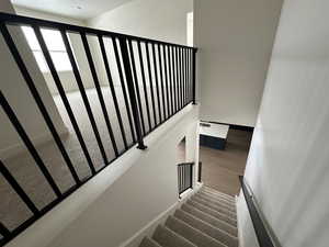 Stairs featuring wood-type flooring