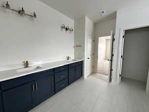 Bathroom featuring vanity and a textured ceiling