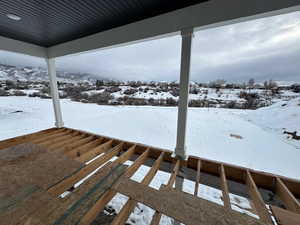 View of yard layered in snow