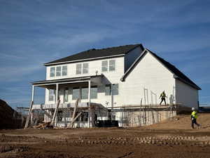 Rear view of property with a porch