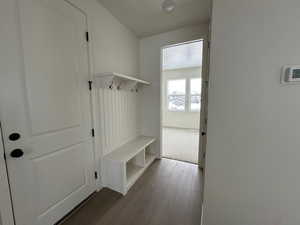 Mudroom with hardwood / wood-style flooring