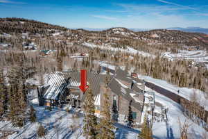 Snowy aerial view with a mountain view