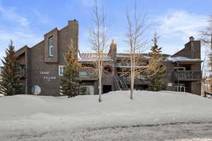 View of snow covered rear of property