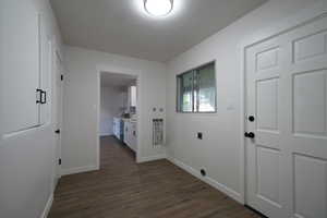 Hallway featuring dark hardwood / wood-style flooring