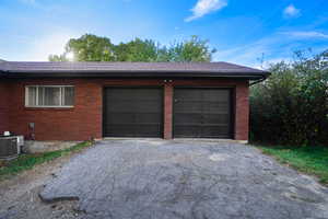 Garage featuring central AC unit