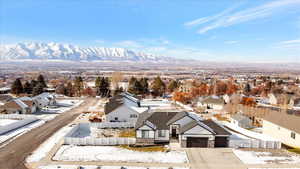 Snowy aerial view with a mountain view