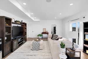 Living room with light hardwood / wood-style flooring