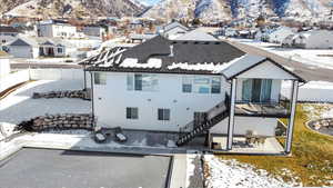 Snowy aerial view with a mountain view