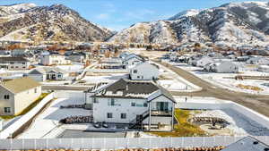 Snowy aerial view with a mountain view