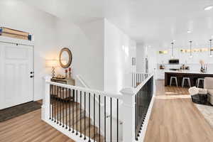 Corridor featuring light hardwood / wood-style flooring