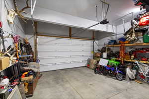 Garage featuring a garage door opener