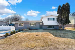 Tri-level home with a front yard