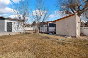 View of yard featuring a storage unit