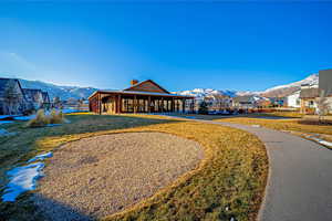 Exterior space featuring a mountain view and a yard