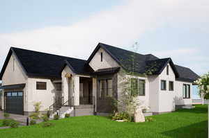 View of front of home with a garage and a front lawn