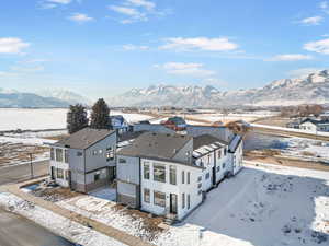 Snowy aerial view featuring a mountain view