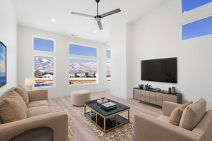 Living room featuring ceiling fan and hardwood / wood-style floors