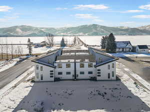 Snowy aerial view with a mountain view