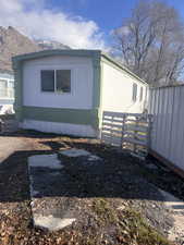 View of side of home featuring a mountain view