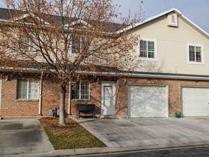 View of front facade featuring a garage