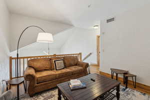 Living room with hardwood / wood-style floors