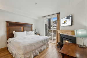 Bedroom featuring light wood-type flooring and access to exterior