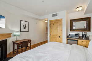 Bedroom featuring dark wood-type flooring