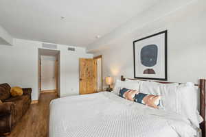 Bedroom featuring wood-type flooring