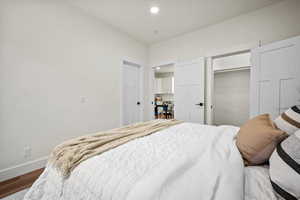 Bedroom featuring hardwood / wood-style floors and a closet