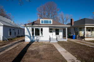 Bungalow-style house with a porch