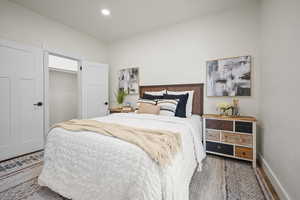 Bedroom featuring wood-type flooring