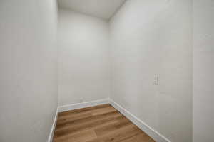 Unfurnished room with hardwood / wood-style floors