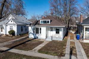 Bungalow-style house with a porch