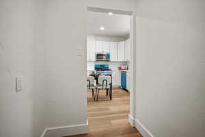 Hallway featuring light wood-type flooring