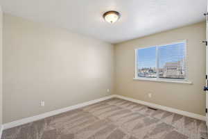 Empty room with carpet floors