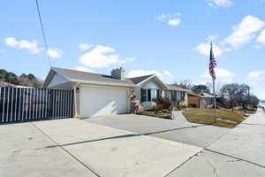 Ranch-style house featuring a garage