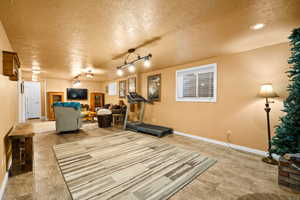 Exercise room with a textured ceiling