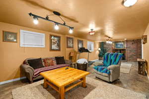 Living room featuring a textured ceiling