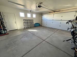 Garage featuring a garage door opener