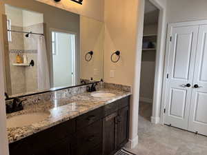 Bathroom featuring vanity and walk in shower