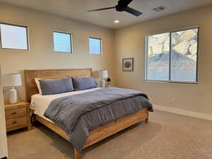 Bedroom featuring ceiling fan and light colored carpet