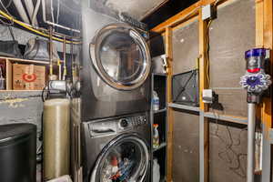 Laundry room with stacked washer and dryer.  Lots of storage!